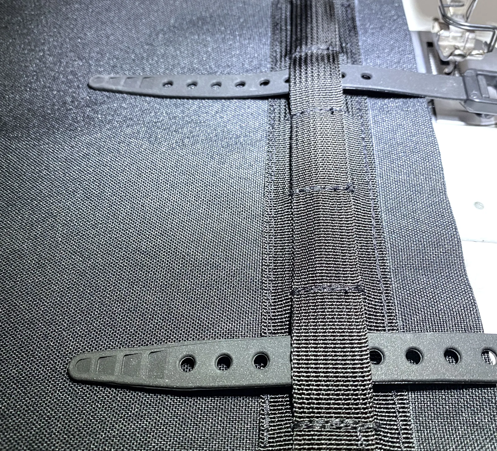 The back panel of a small Kawa pannier, half sewn with straps