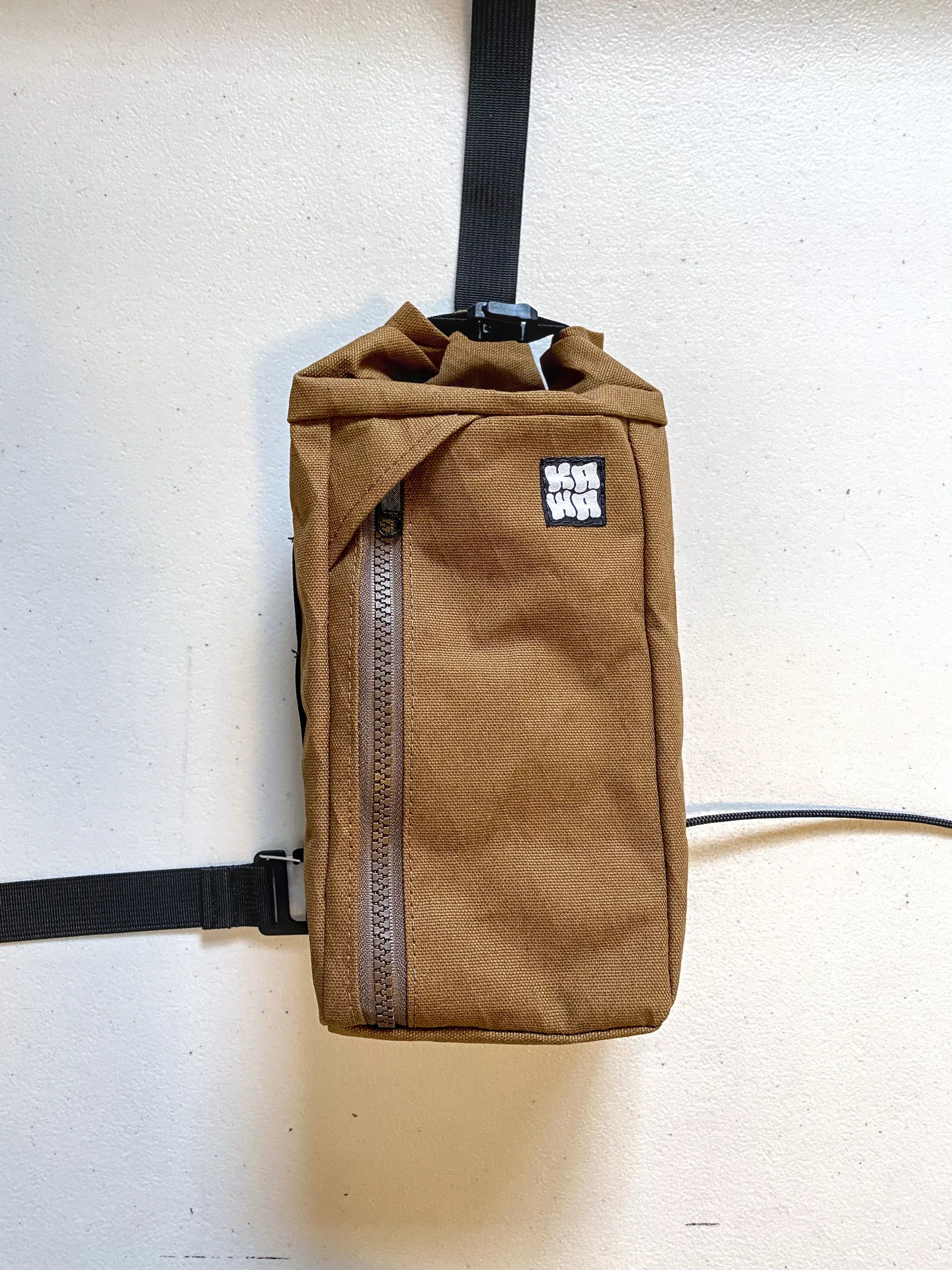 A brown Kawa sling on a table