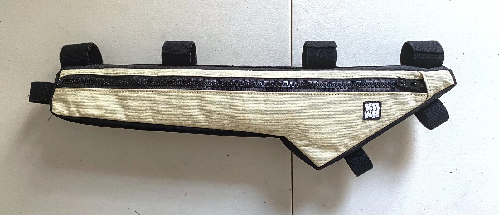 A Kawa half frame bag on a table
