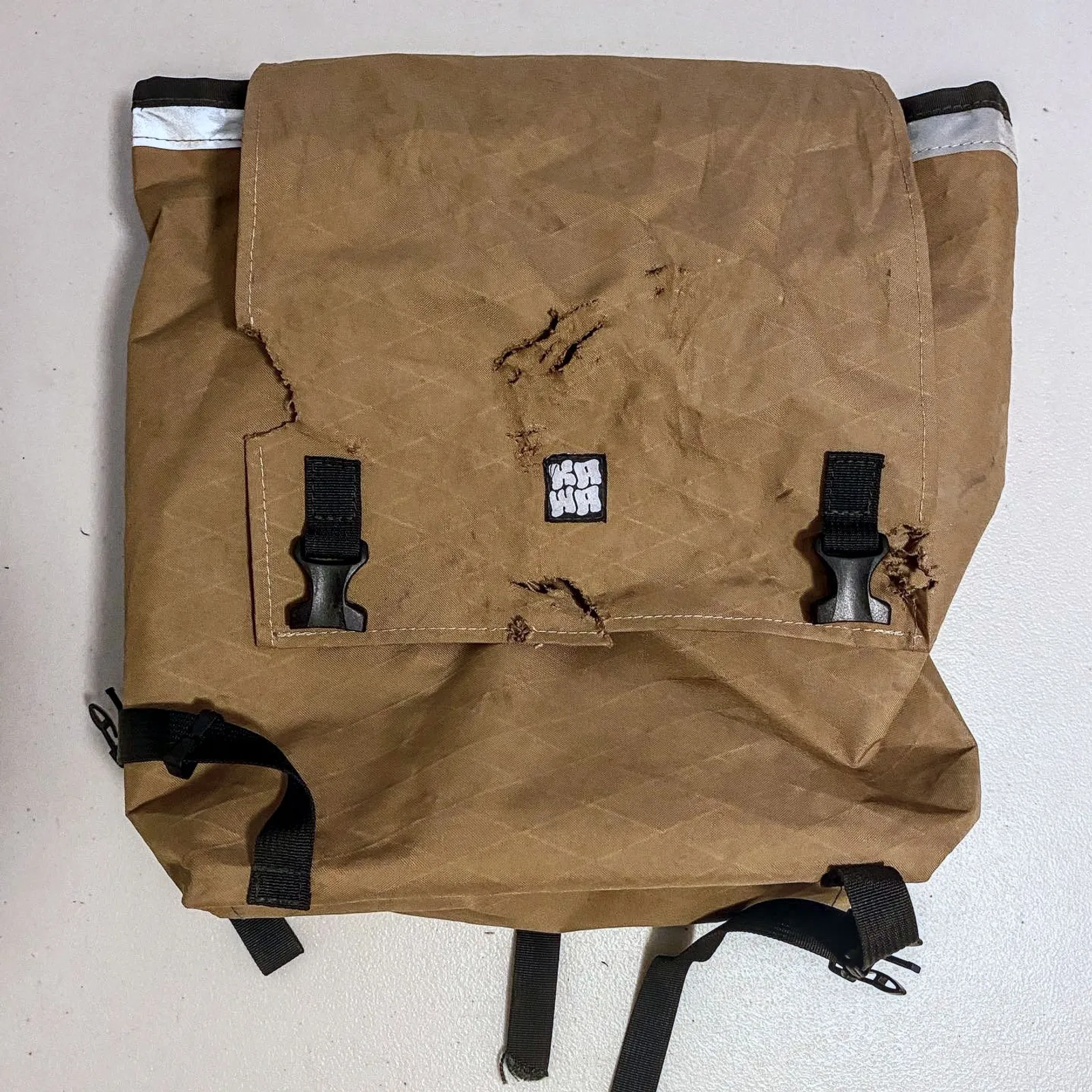 A torn up Kawa pannier