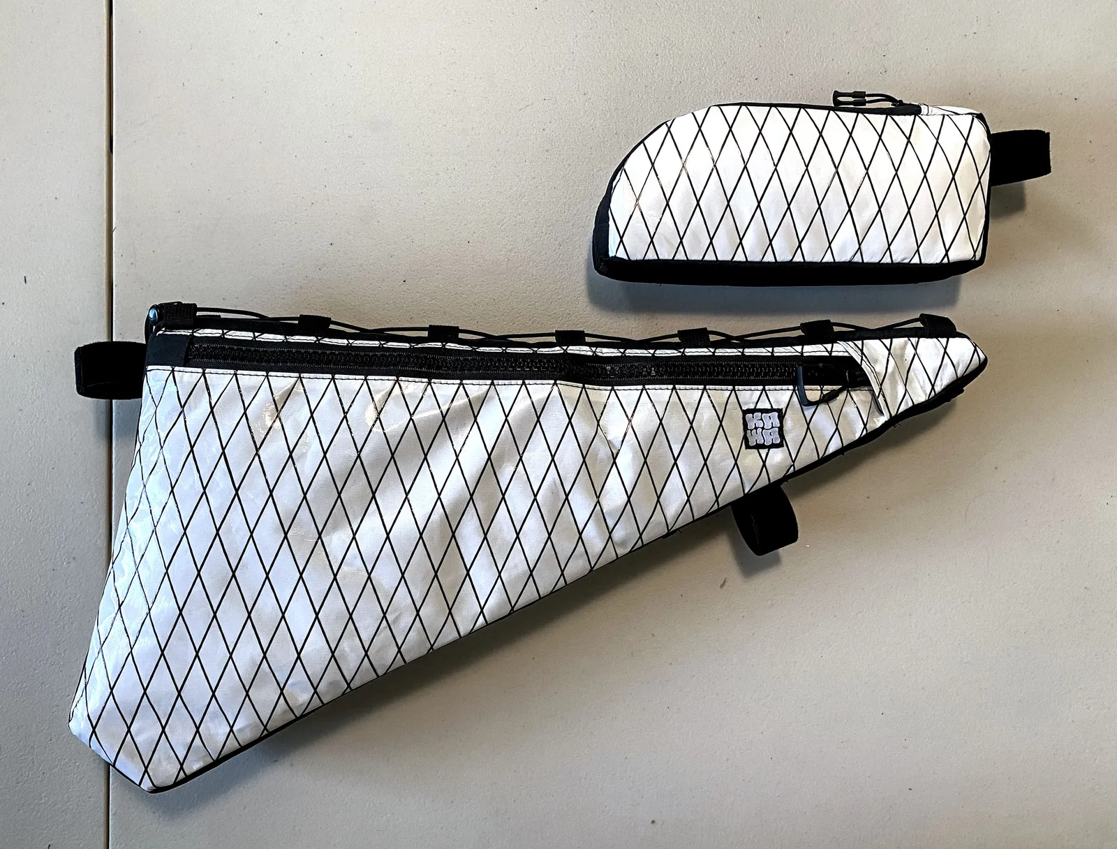 A white framebag and top tube bag