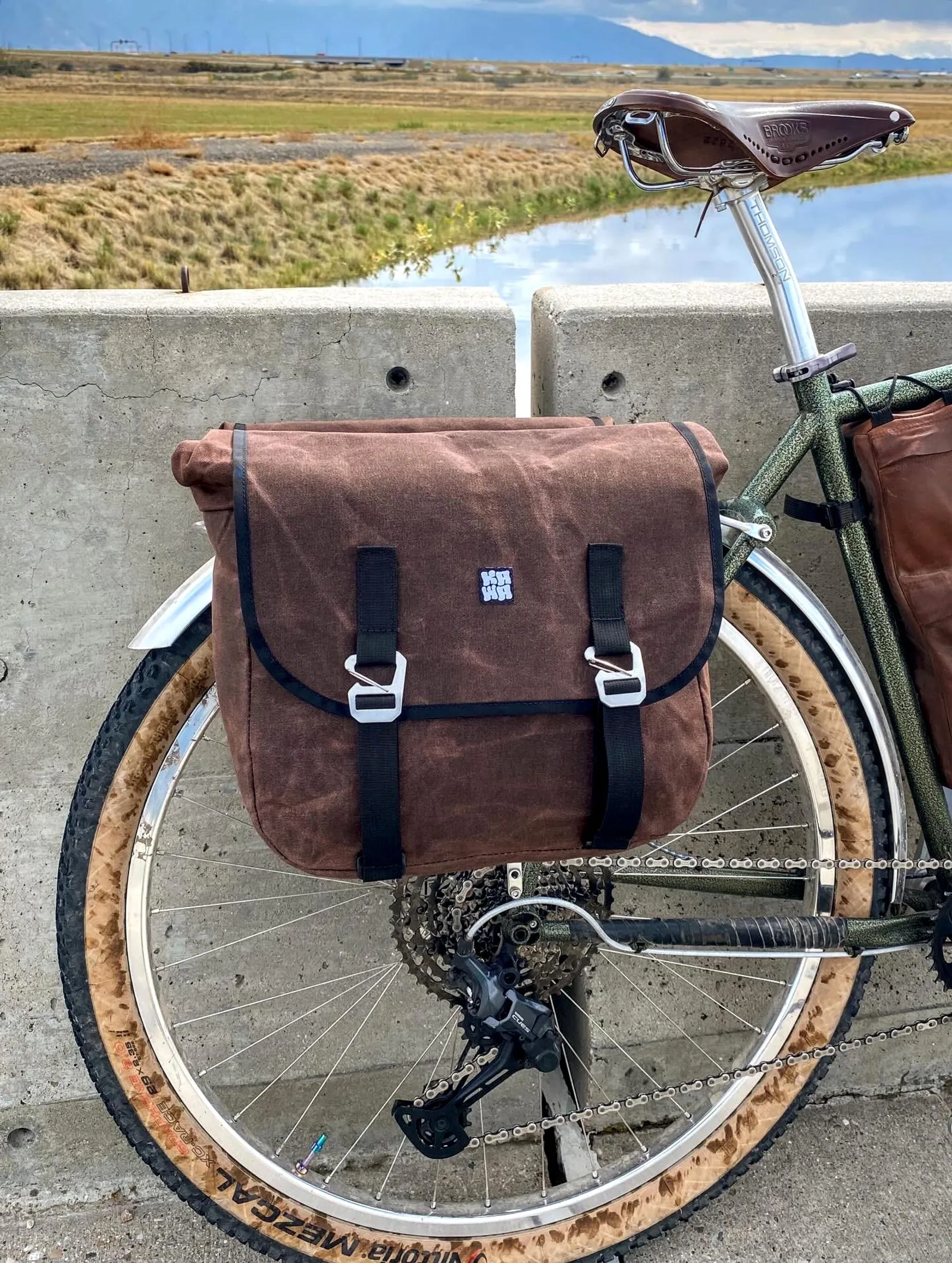 Large Kawa pannier on a bike on a bridge