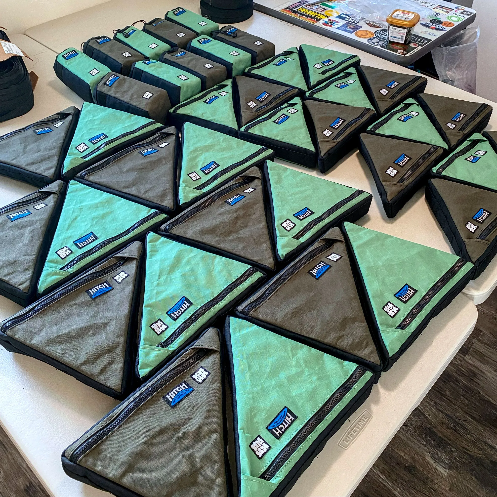 Lots of Kawa bags on a table, lined up