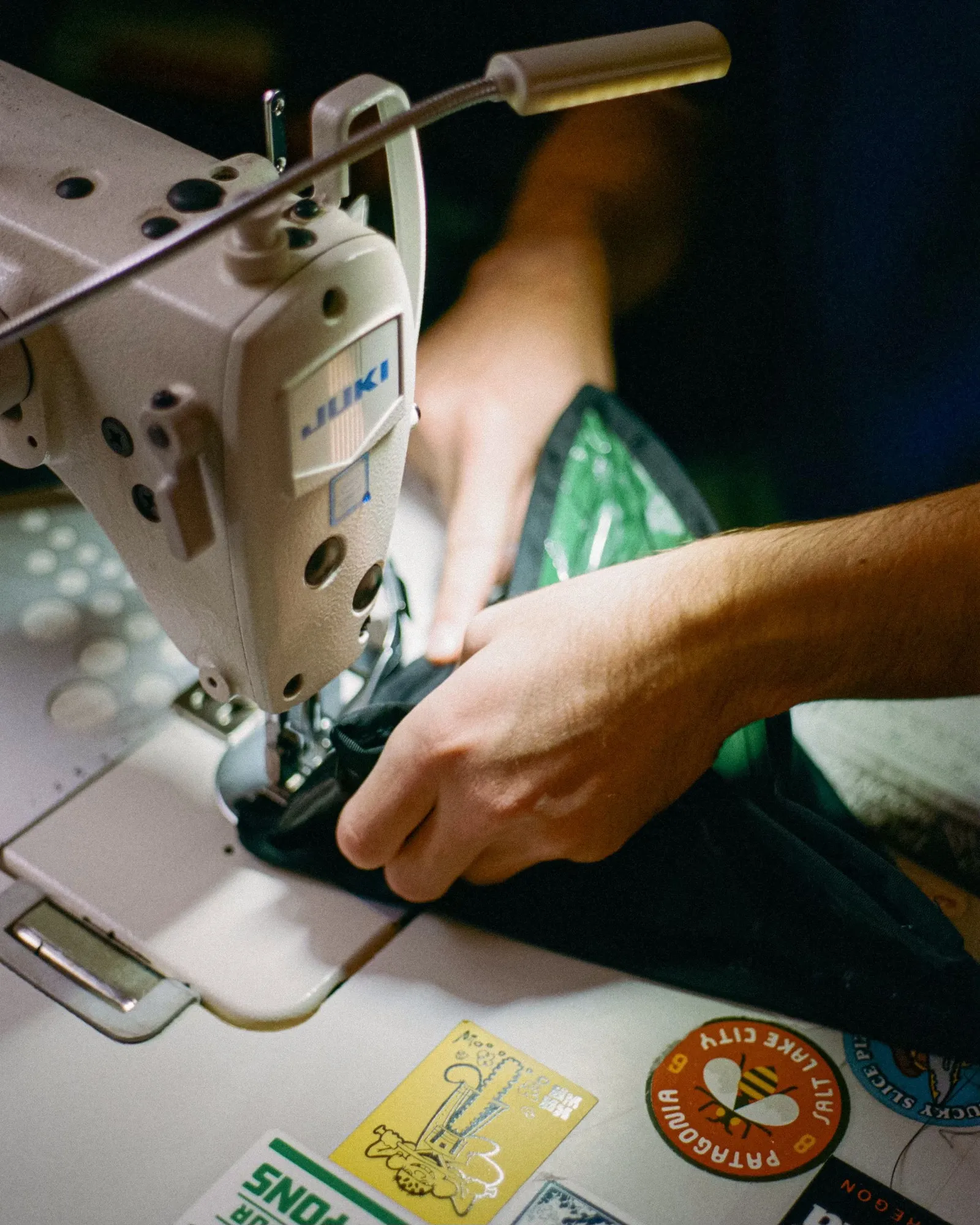 River sewing a bag, hands only