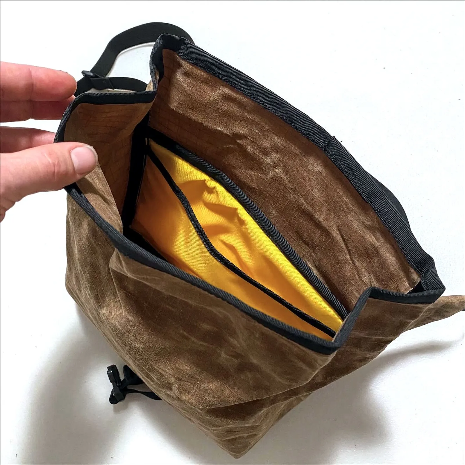 Waxed canvas Kawa hip pack being opened