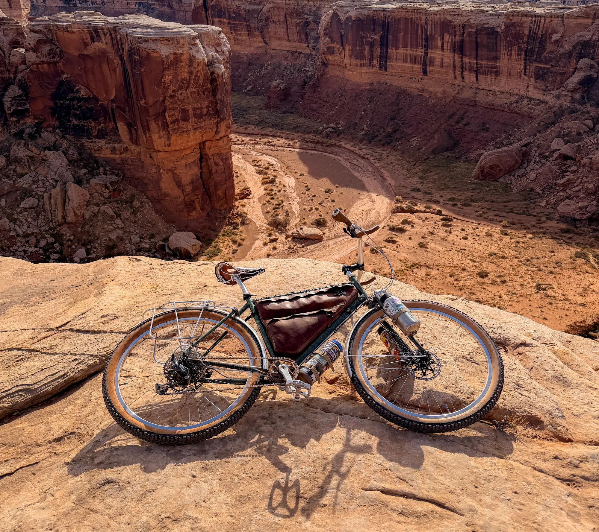 The Piolet parked on a canyon overlook above the White Rim road with the Colorado River far below