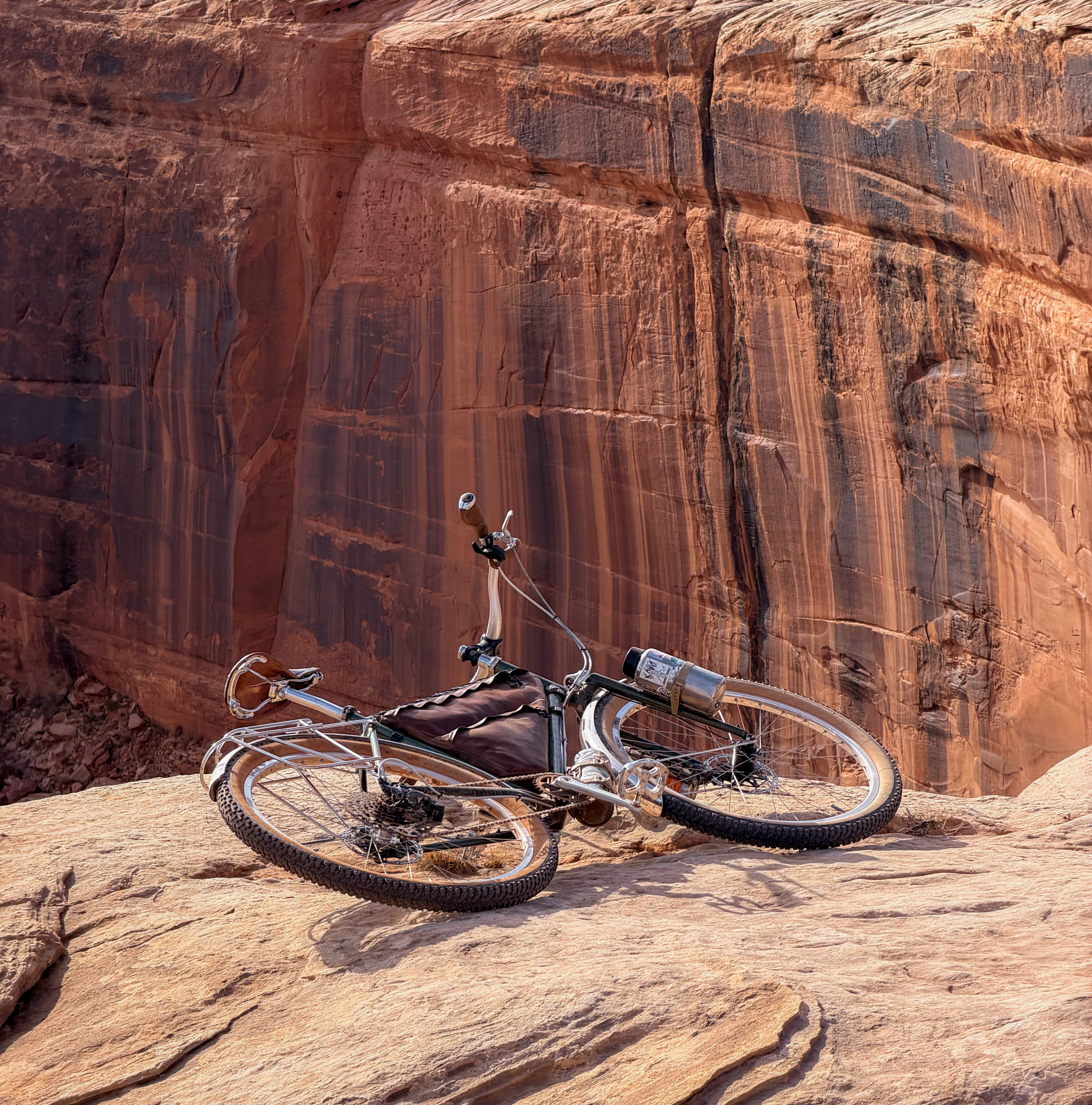 Resting against the sandstone The Piolet laid on its side against a towering red sandstone wall